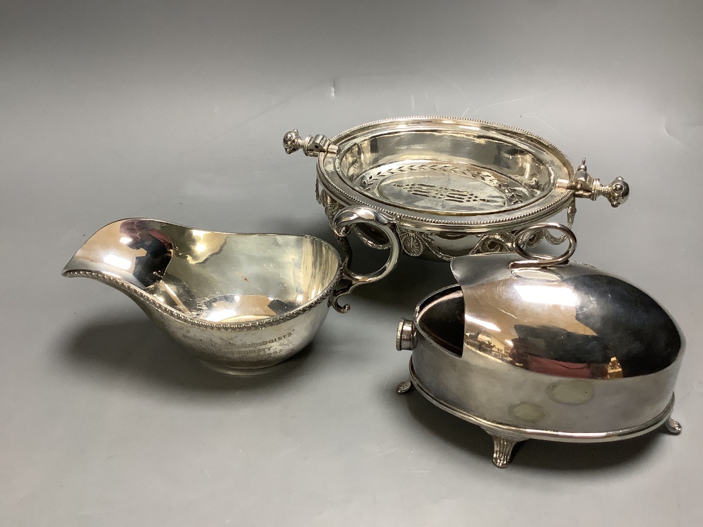 A pair of silver-plated Corinthian column candlesticks, height 28cm a small roll-top breakfast dish, a spoon warmer and five other plated items